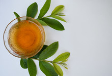 Organic Guava Tea With Leaves Against White Background