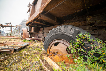 Close up of a wheel deep in soil. Military vehicle abandoned in Greenland. 