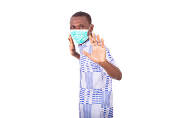 portrait of a young man with medical mask making rejection gesture.