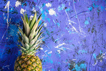  Fresh sweet pineapple on blue textured background, top view copy space