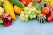 Seasonal fruits and vegetables on blue background. Autumn harvest.