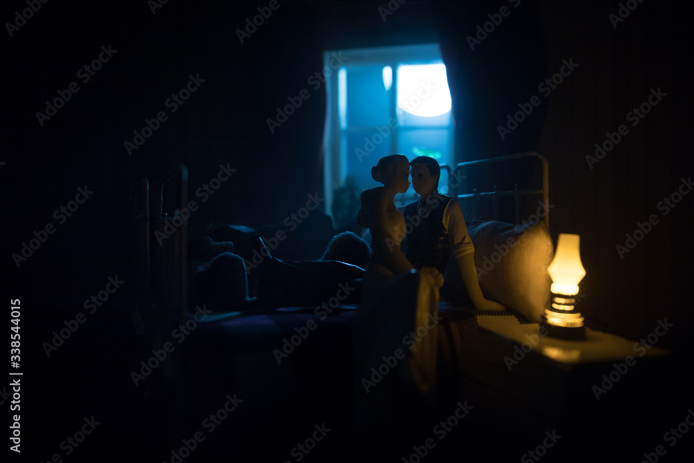 Beautiful passionate young couple lying on bed and having sex. Sensual
