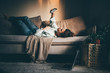 © Mariia Korneeva - Bored woman in self isolation laying on the sofa. Woman in quarantine for coronavirus working from home.