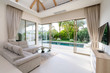 © korakoch - Interior and exterior design of living room with pool view in villa, house, home, condo and apartment