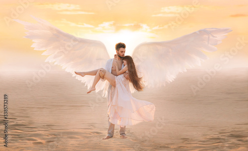 Cuadros en Lienzo Strong male costume angel holds hug fragile innocent woman in arms