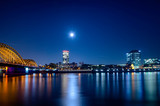 Fototapeta  - Night view from Cologne with a bridge. Night Cologne view to the Rhein.