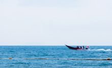 Lone Boat In Calm Blue Sea