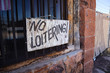 Old Faded No Loitering Sign