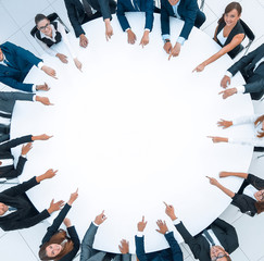 Poster - group of business people sitting at the round table. the business concept