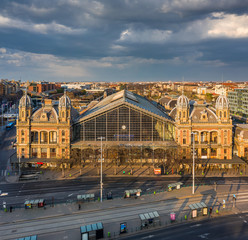 Wall Mural - Budapest, Hungary - Aerial view of the Nyugati Railway Station in warm sunlight at sunset. The streets are totally empty due to the 2020 Coronavirus covid-19 disease quarantine