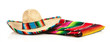 A woven Mexican sombrero or hat with a colorful serape blanket