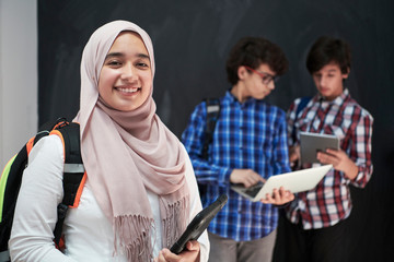 Wall Mural - Arab teenagers group working on laptop and tablet computer