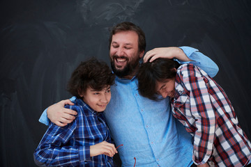 Wall Mural - happy father hugging sons