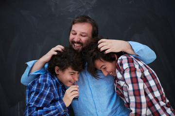 Wall Mural - happy father hugging sons