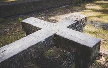 Stone Cross On Ground