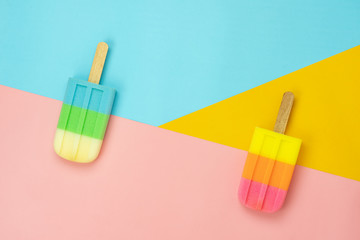 Table top view aerial image of sign or food of summer season holiday background concept.Flat lay of pastel ice cream on modern rustic mix paper backdrop.Minimalism creative design.copy space.