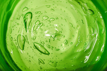 Aloe Vera cosmetic gel. Gel texture with bubbles on isolated white background. Concept of natural cosmetics. Close-up, macro