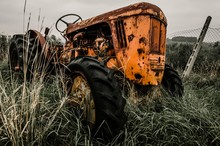Abandoned Tractor In Field