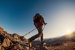 © cppzone - Hiker with backpack explores mountains at sunset