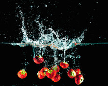 Strawberries In Water Splash