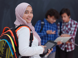 Wall Mural - Arab teenagers group working on laptop and tablet computer