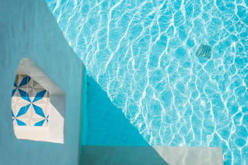 blue swimming pool in the hotel