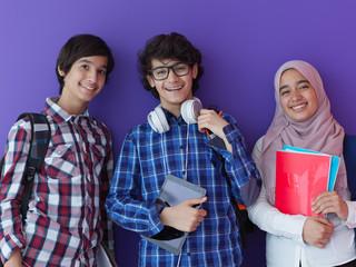 Wall Mural - Arab teenagers group working on laptop  computer together