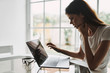 © SHOTPRIME STUDIO - Woman at home in front of laptop communicating