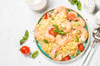 © nadianb - Pasta seafood with shrimp on white table.