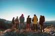 © cppzone - Group of hikers on mountain top at sunset