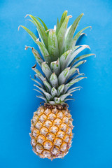 Sticker - Aerial view of pineapple blue background