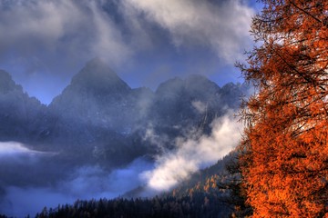 Poster - High Alpine mountains rising through the clouds