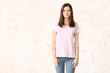 © Pixel-Shot - Woman in stylish t-shirt on light background