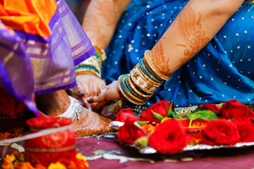 Indian wedding ceremony: bridal hand in haldi ceremony