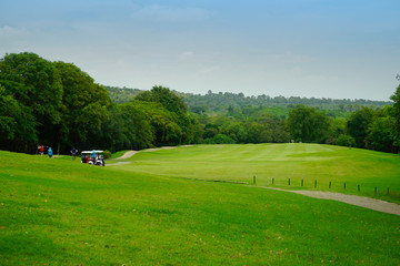 Background of evening golf course has sunlight shining down at golf course in Thailand