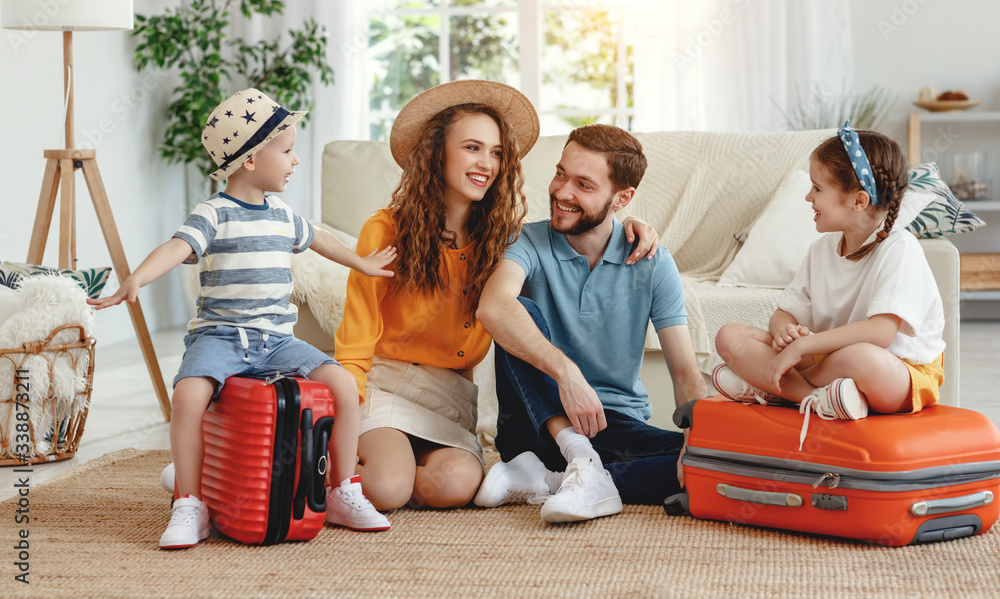Cheerful family with suitcases on floor - obrazy, fototapety, plakaty 