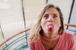 caucasian funny girl sticking out tongue
