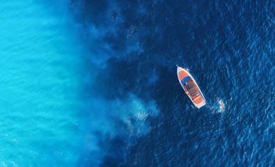 Wall Mural - croatian seascape with boat. yachts at the sea surface. aerial view of luxury floating boat on blue 