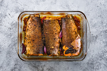 Sticker - Top view of pan with red salmon baked in oven with spice