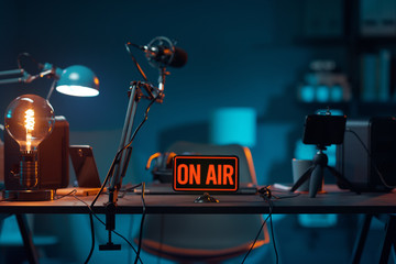 live online radio studio with on air sign