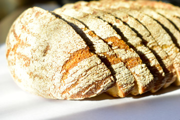 Wall Mural - Sliced rye bread with spices on a white background