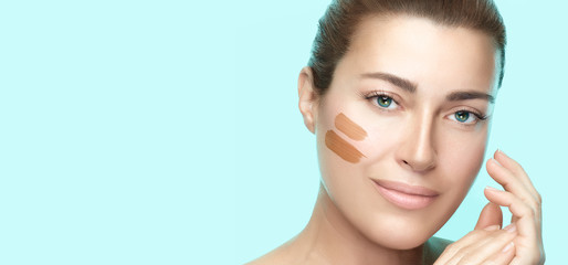 makeup swatches lines on beauty model face. young woman with perfect fresh clean skin