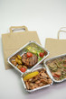 Take-away food, bring your lunch in business boxes, or foil containers.