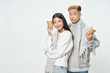 © SHOTPRIME STUDIO - Cheerful young couple of Asian appearance studio lifestyle warming drinks
