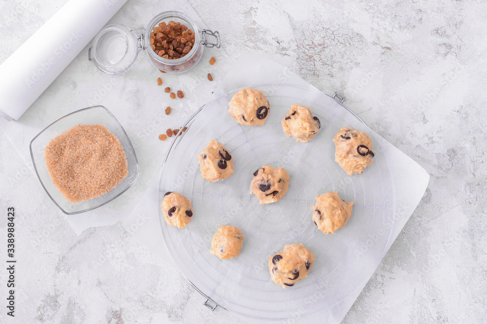 Uncooked cookies on color background