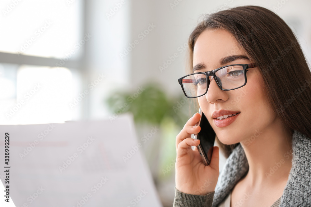 Beautiful young woman working at home