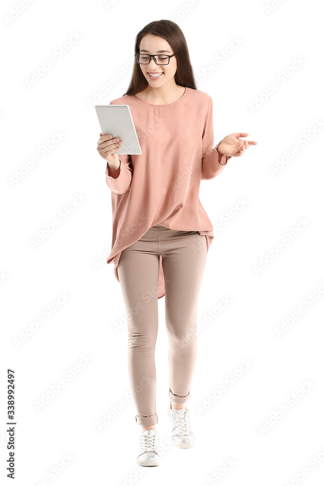 Beautiful young woman with tablet computer on white background
