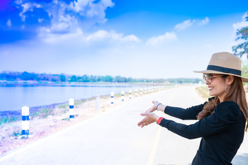 Canvas Print - Asian Woman with Mae Moh Reservoir Background