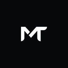 Minimal Elegant Monogram Art Logo. Outstanding Professional Trendy Awesome Artistic MT TM Initial Based Alphabet Icon Logo. Premium Business Logo White Color On Black Background