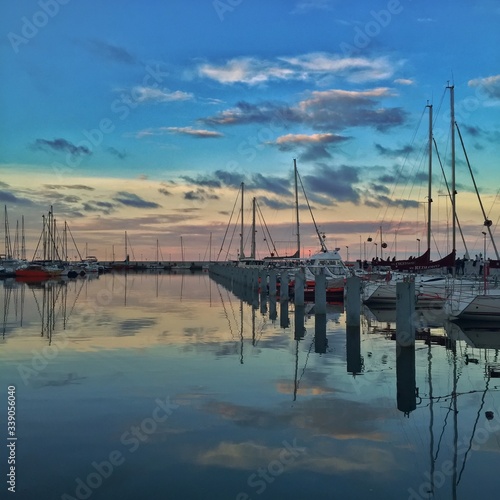 Boats Moored At Port Of Gdynia Against Sky